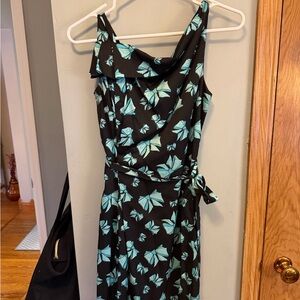 Black sleeveless dress with blue bow pattern